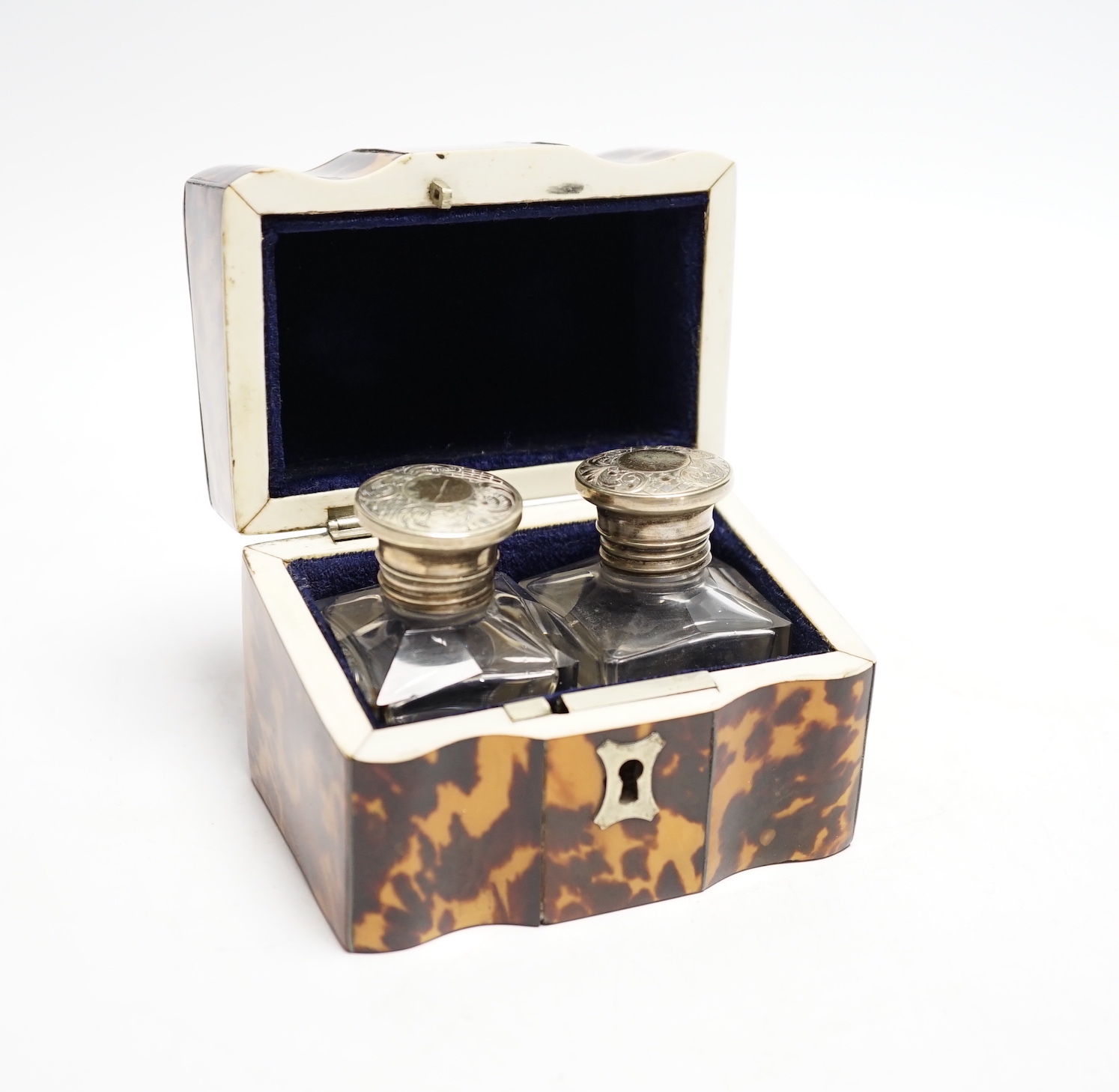 A Victorian tortoiseshell cased pair of glass scent bottles with white metal lids, 9.5cm, CITES Submission reference UN4WUEH8